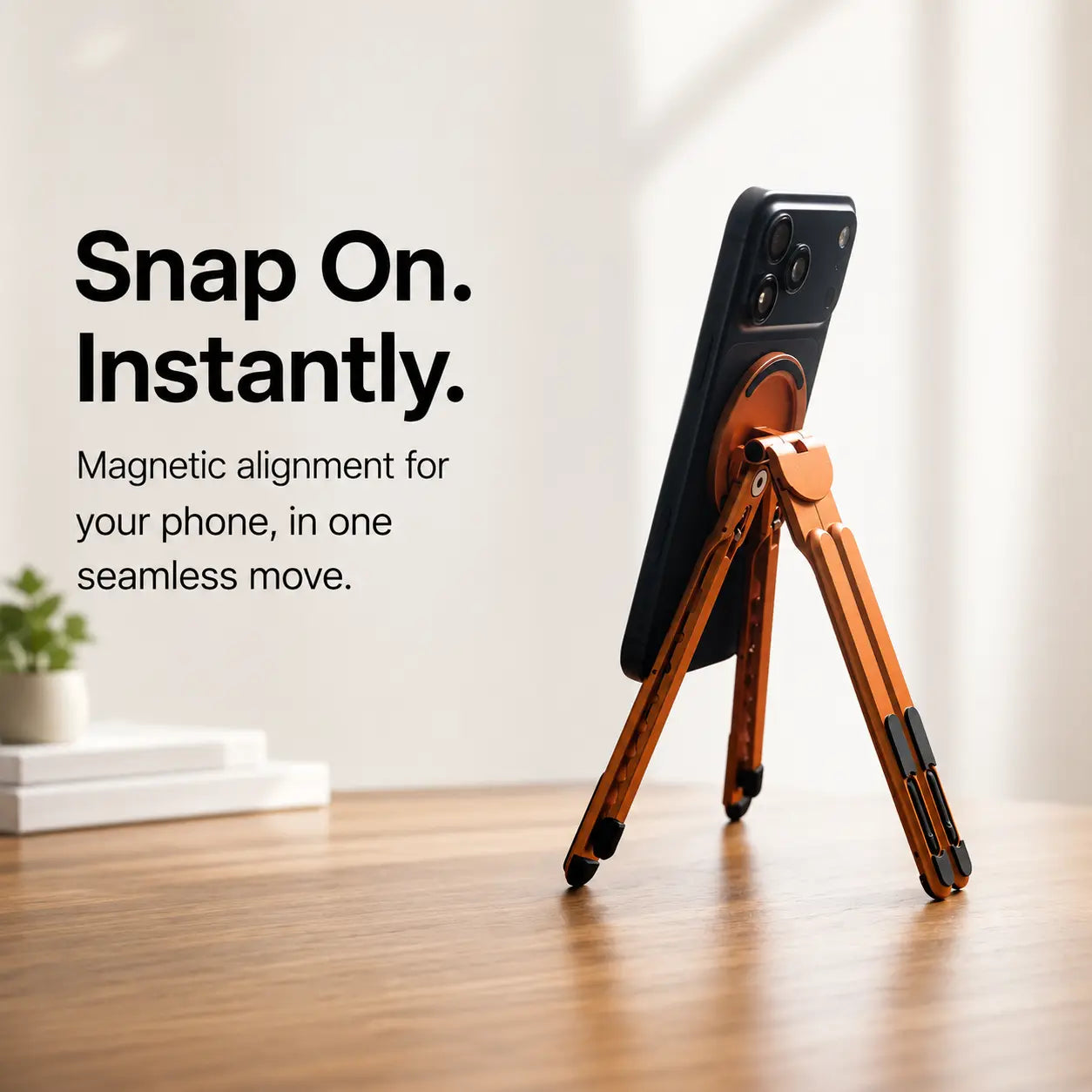 Cosmic Orange folding magnetic device stand holding a phone magnetically #color_Cosmic Orange