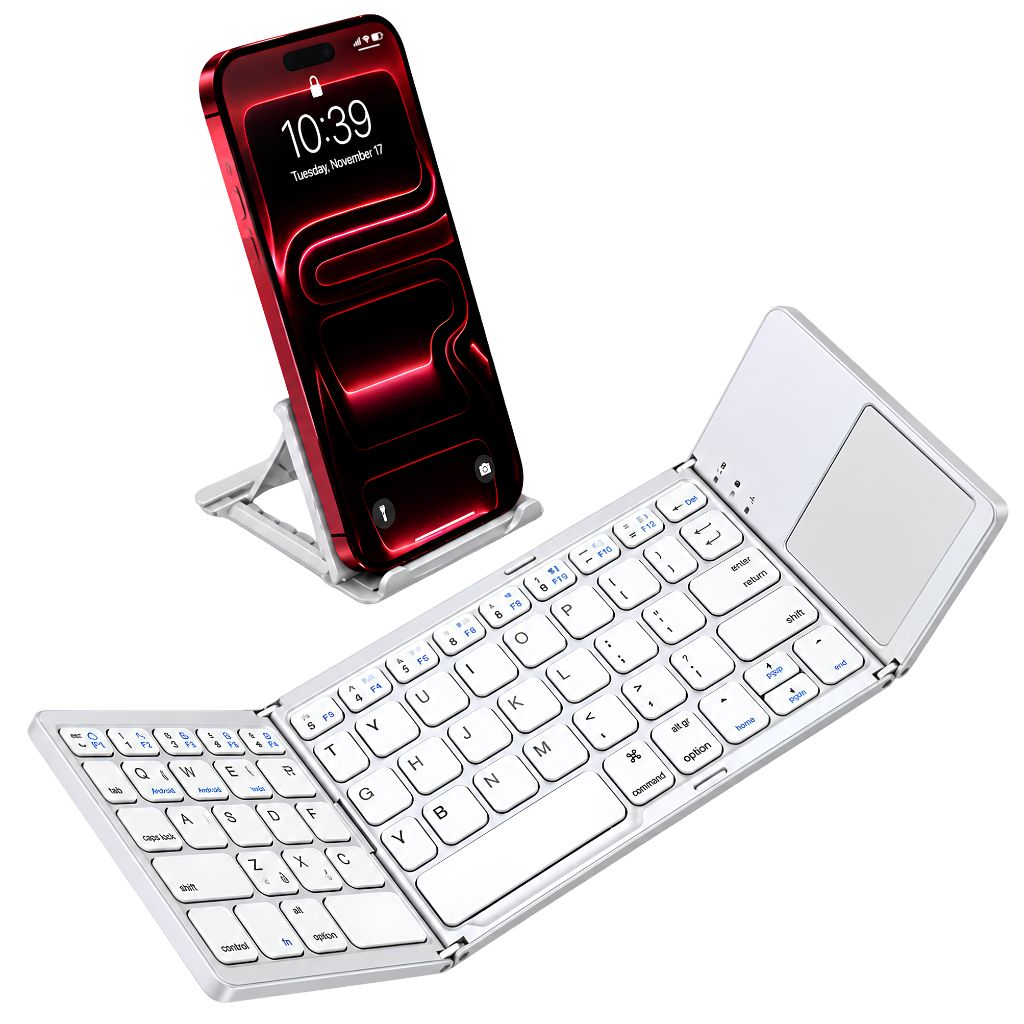 A white compact foldable wireless keyboard shown open, with a smartphone propped behind it on a clear stand. The phone screen displays a red wallpaper, but the product being sold appears to be the keyboard.