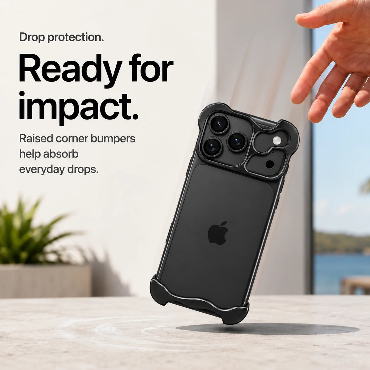 Black sculpted metal phone case demonstrating raised corner protection during a drop #color_Midnight Black