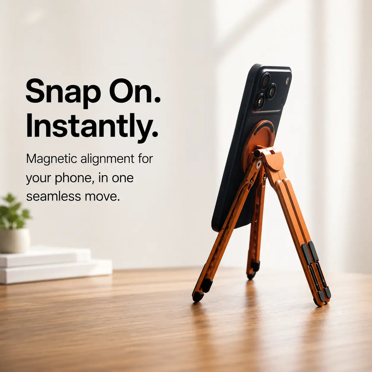 Cosmic Orange folding magnetic device stand holding a phone magnetically #color_Cosmic Orange