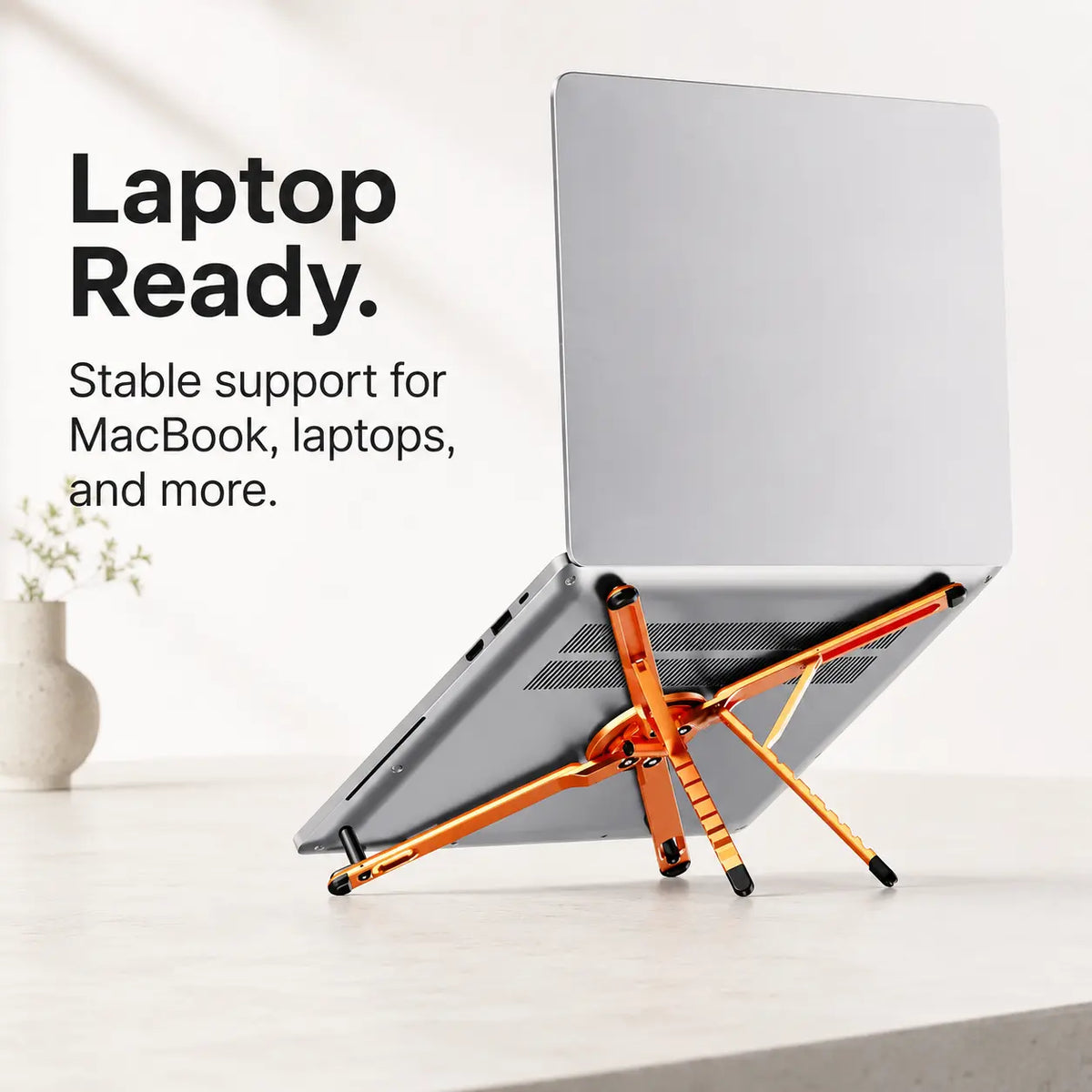 Cosmic Orange folding magnetic device stand supporting a laptop #color_Cosmic Orange