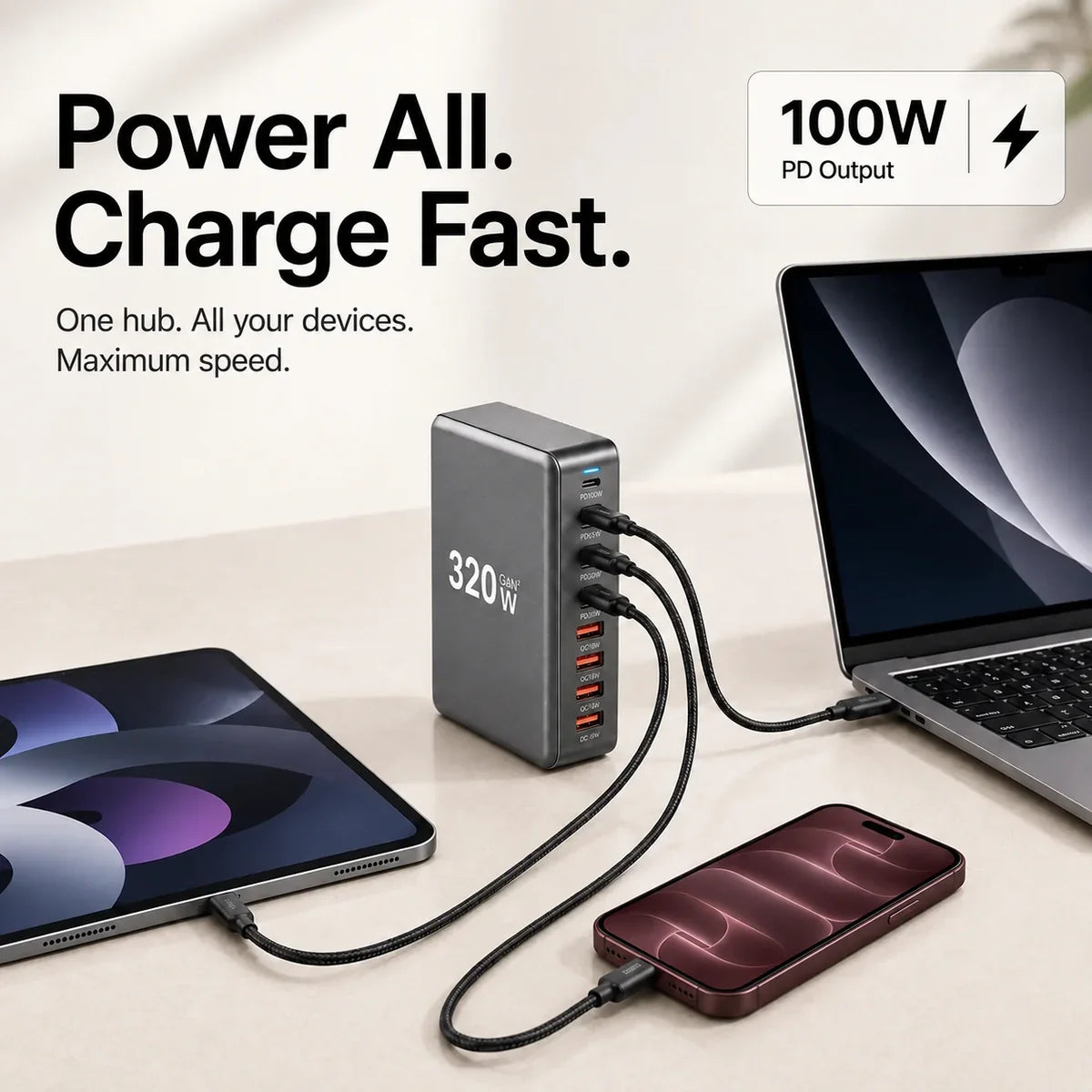 PowerHub 320W charging a laptop, tablet and smartphone simultaneously.